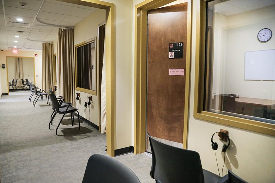 The outside of the individual treatment spaces have headphones so that family members can listen in while watching through the two way mirror.