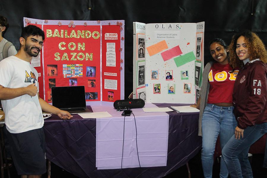 Two members of the Organization of Latinx American Students at the their table at the involvement fair.