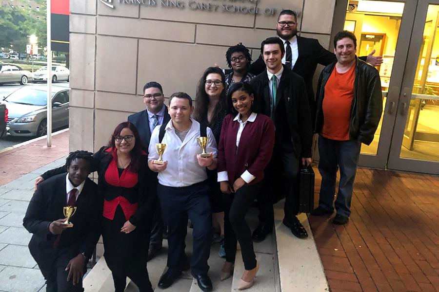 A group of the Mock Trial team after winning awards at a competition.