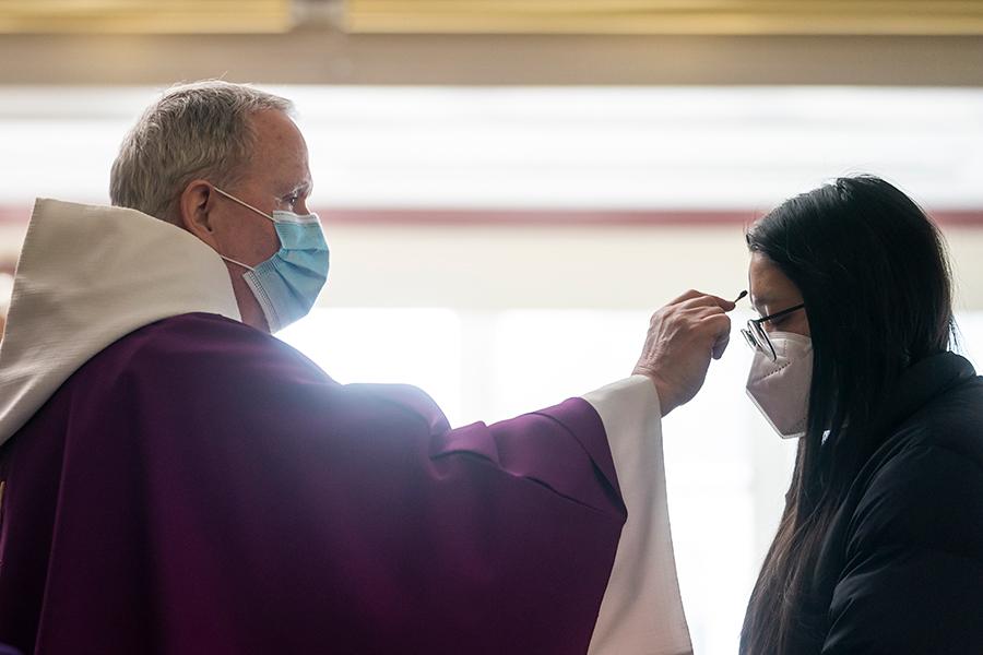 Fr. Mulvey gives ashes on Ash Wednesday 2021.