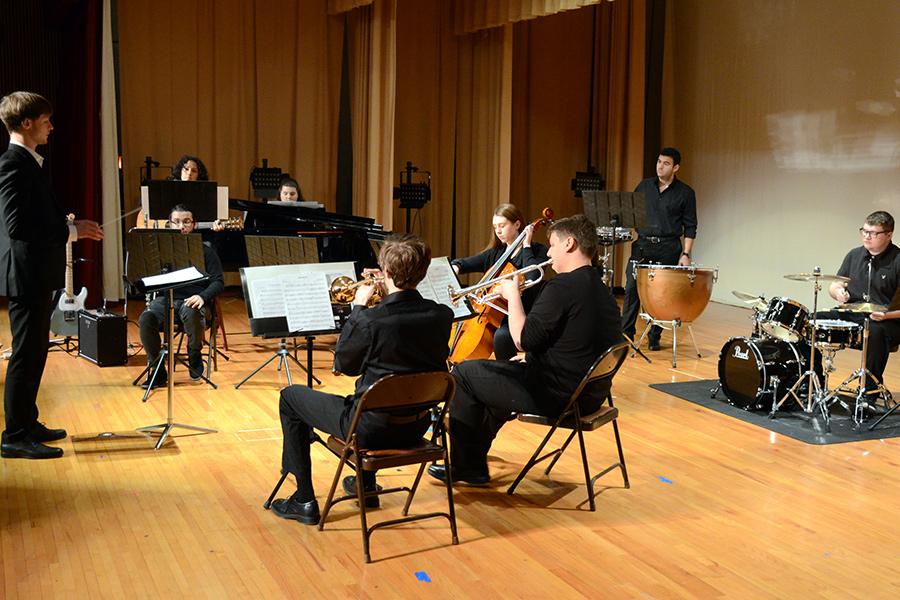 A student ensemble with a student conductor.