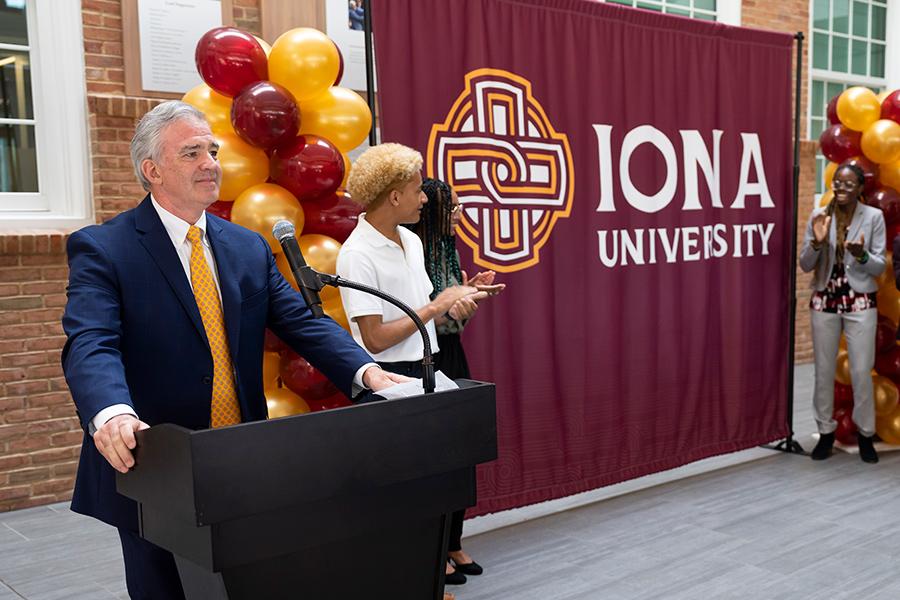 President Carey speaking at the Iona University announcement.