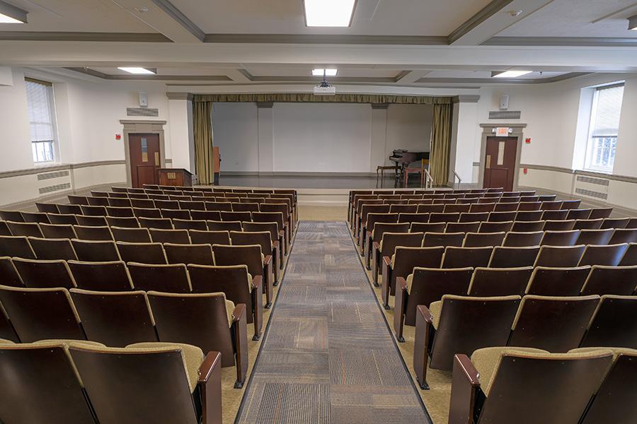 Seats facing the stage in Romita Auditorium.