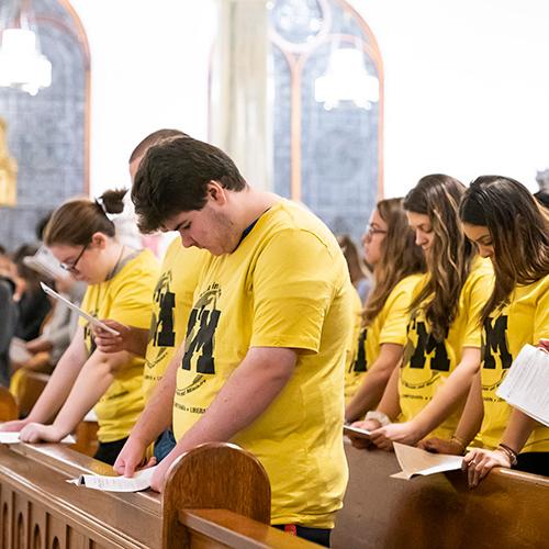 Mission and Ministry students bow their heads during the blessing.