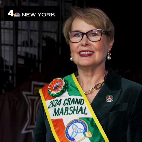 Maggie Timoney with the Grand Marshal sash and NBC New York logo