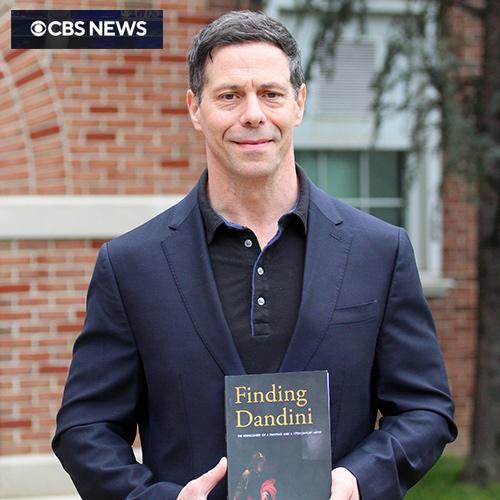 Thomas Ruggio with his book and the CBS logo.