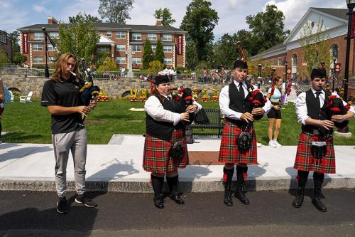 Four pipers play at the Iona birthday party.