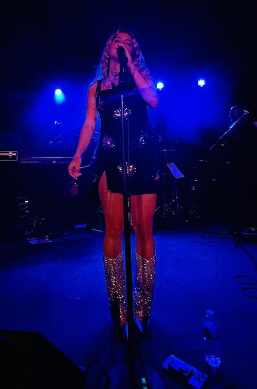 Aidan Carpenter singing at her concert.