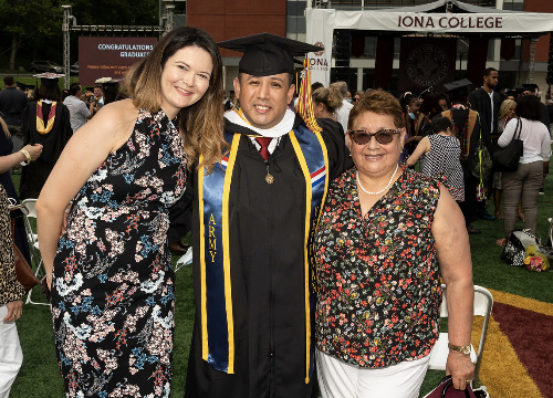 Iona grad Billy Falla posing for photo at 2021 Commencement ceremony
