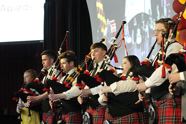 The pipers play at an event.
