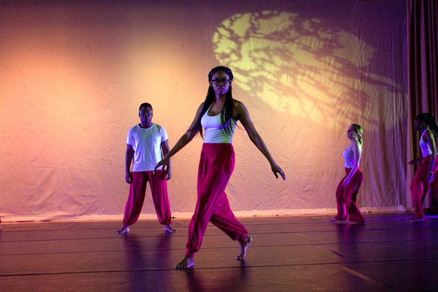 The Iona University Dance Ensemble performs on stage.