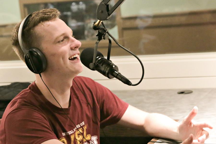 A student on the mic at the radio station in LaPenta.