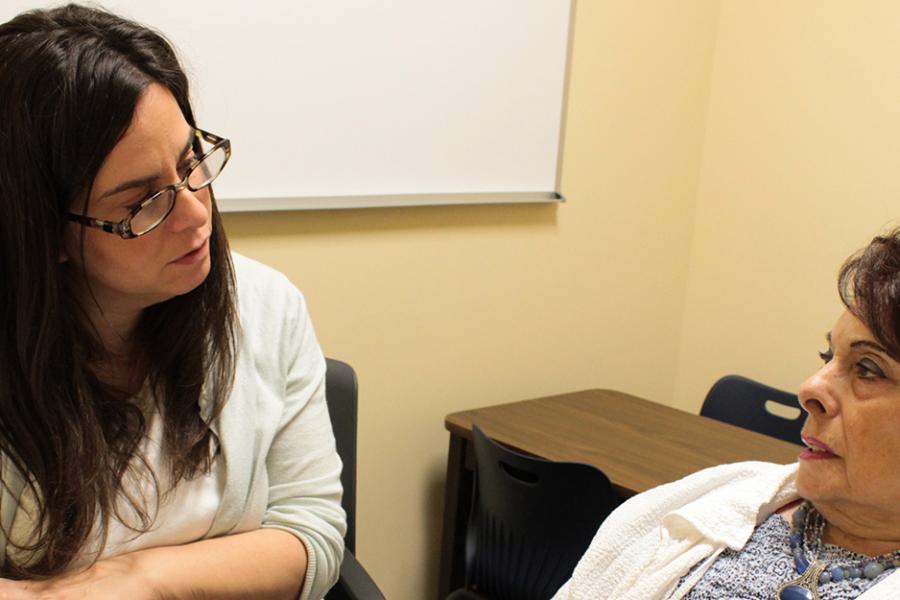 A social worker works with one of her clients.