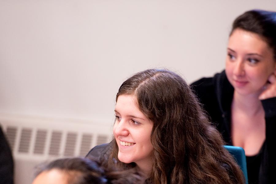 A student smiles in one of her classes for the non-profit public relations certificate.
