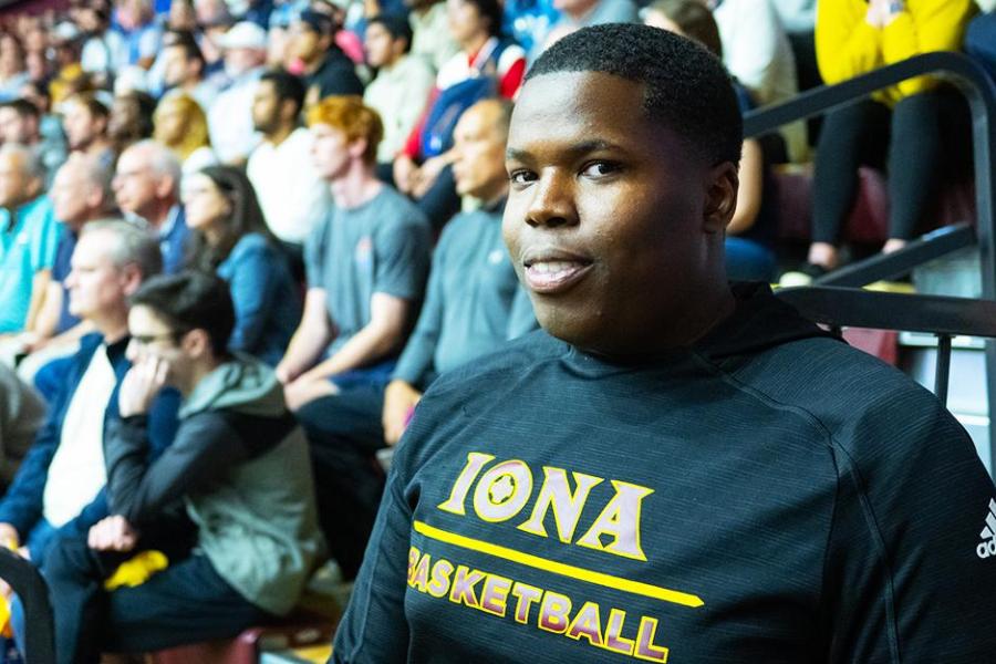 An Iona student worker for Athletics at a basketball game.