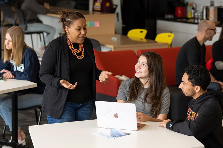 Lendy works with students in the Hynes Institute. 