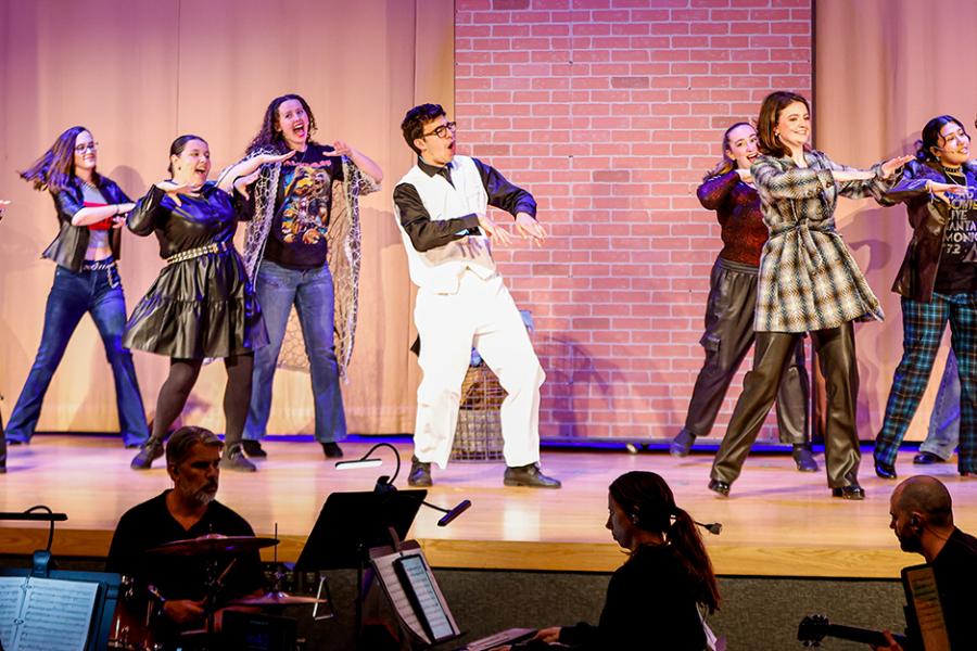 The Iona Players perform on stage. 