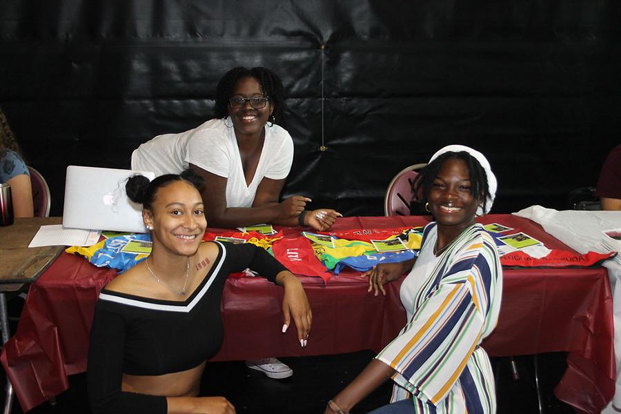 Three members of the Black Student Union recruit at the involvement fair.