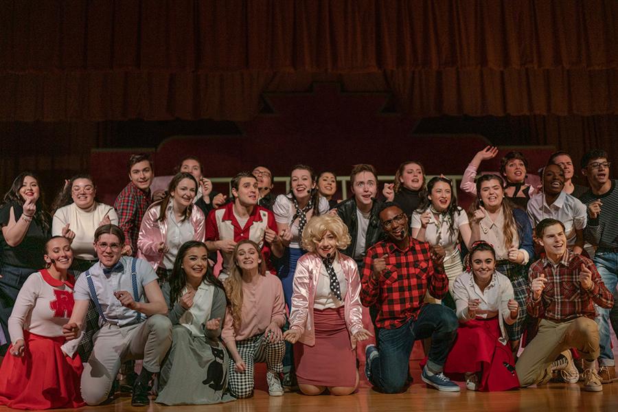 Group shot of the cast of the musical Grease.