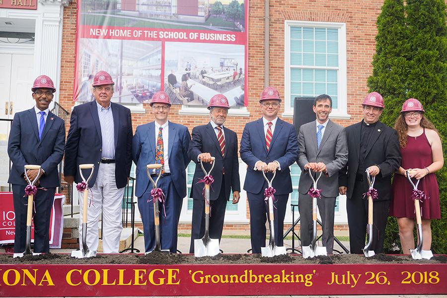 A group shot of the participants with shovels at the LaPenta School of Business groundbreaking.