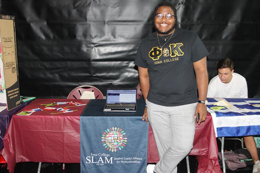 A member of SLAM at the club's table at the involvement fair.
