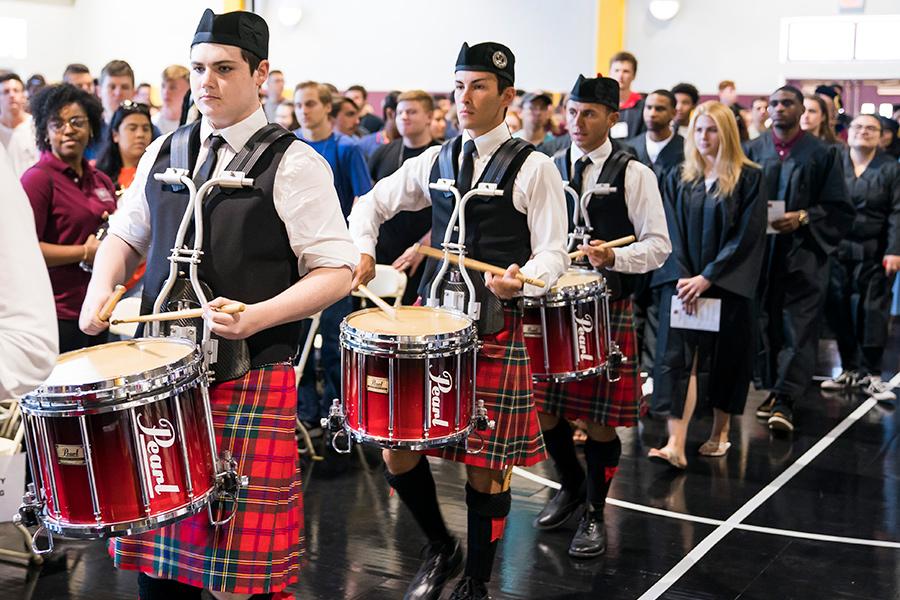 The pipers play at freshmen convocation day at the Hynes athletics center.