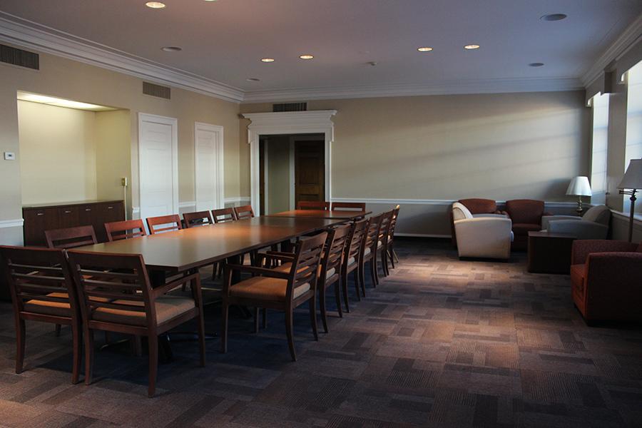 Faculty Dining room has a long rectangular table and chairs.