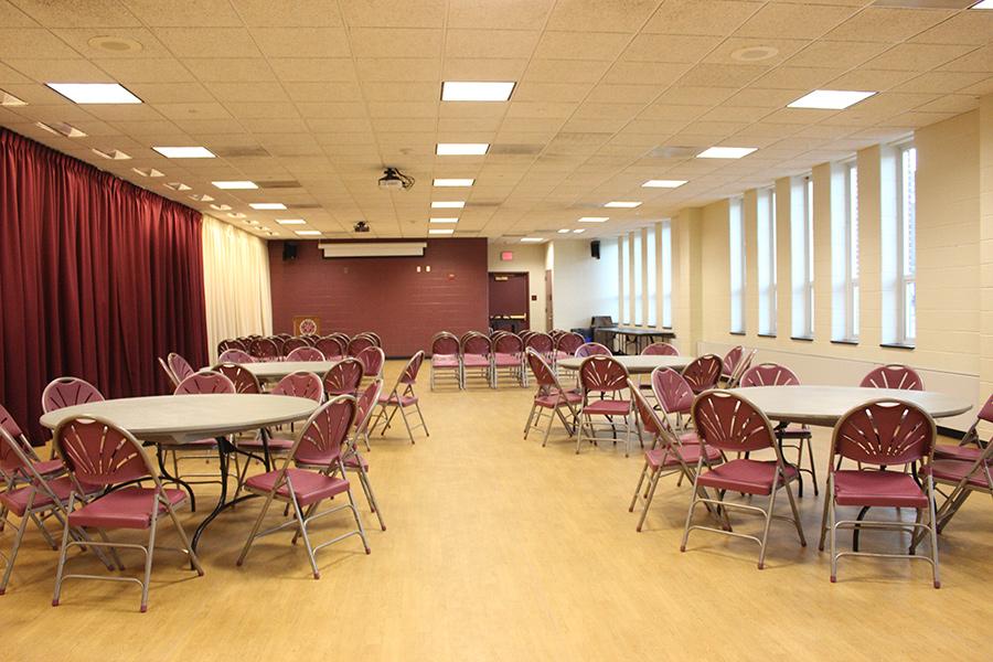 Hegarty Room is set up with several circular tables and chairs.