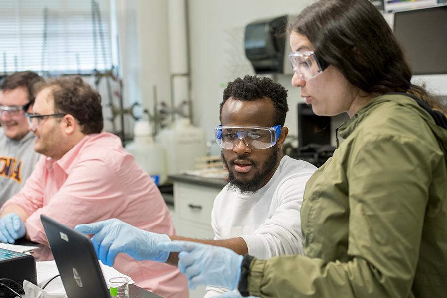 Two students work together in a lab.