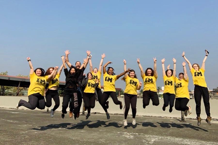 Students on the India Immersion trip jumping in unison for a group photo.