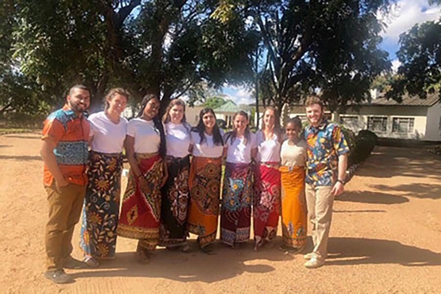 A group of students poses for a photo on a mission trip to Zambia in Africa.