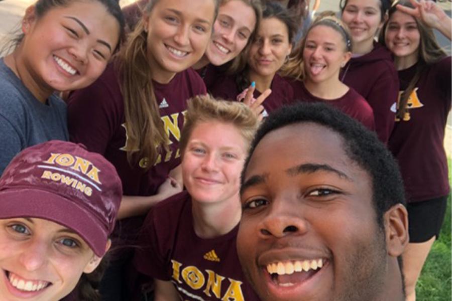 A group of students take a selfie after working on a green project together.