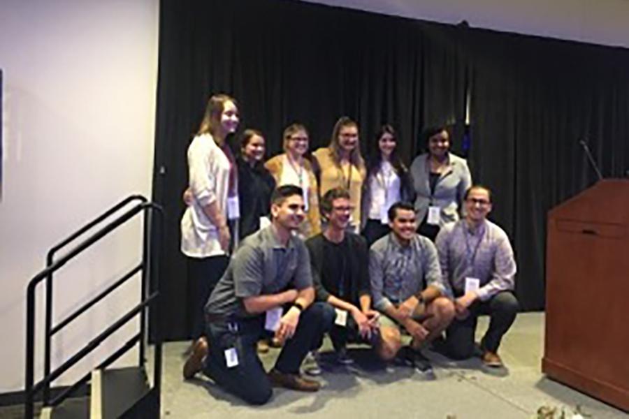 A group of young people pose for a photo at Creighton University.