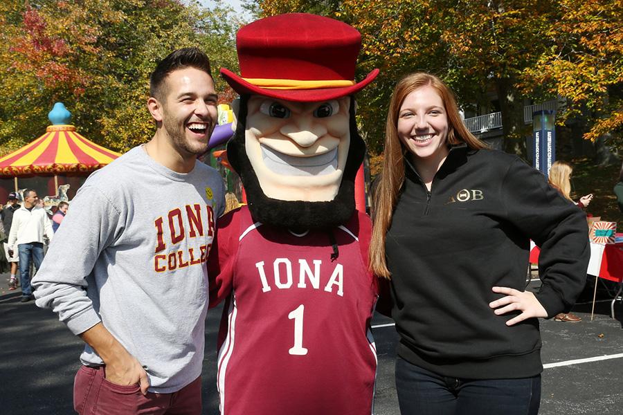 Killian with two students at a homecoming event.