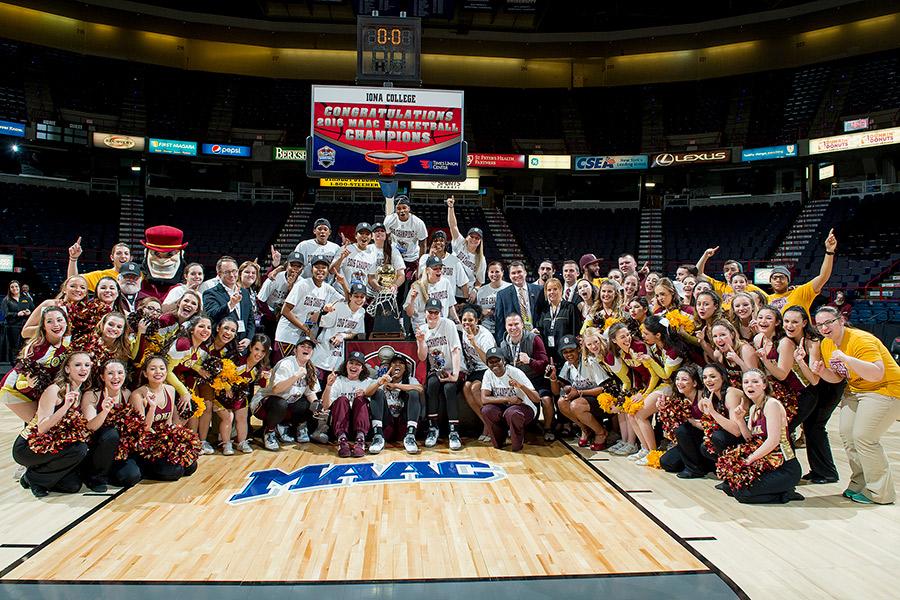 The 2016 Iona women's basketball team pose with their MAAC trophy at the arena.