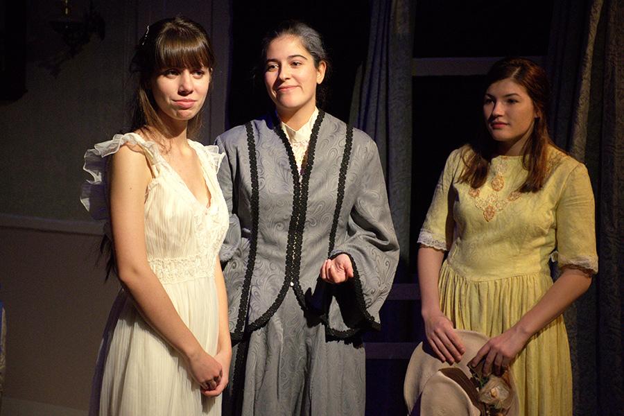 2019 Iona University graduate Gisela and two other actors on stage in a play.