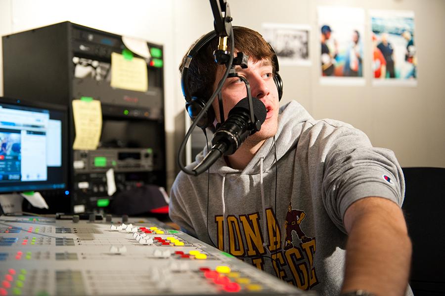 A student on air at the WICR radio station.