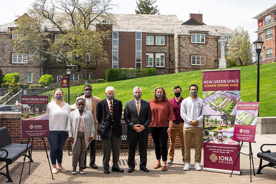 Joseph M. Murphy ’59, ’83H and Iona University President Seamus Carey, Ph.D., with members of the Student Government Association, unveiling of a vibrant new green space coming to campus spring 2022. 
