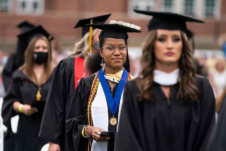 A student looks with confidence at the camera during the 2021 in-person recognition ceremony.