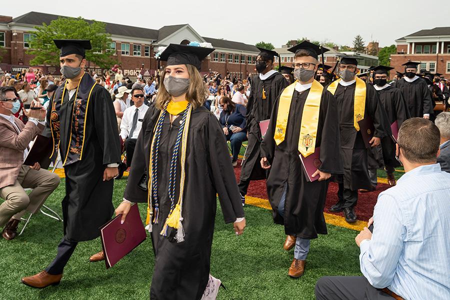 Graduates walk down the aisle at the 2021 in-person recognition ceremony.