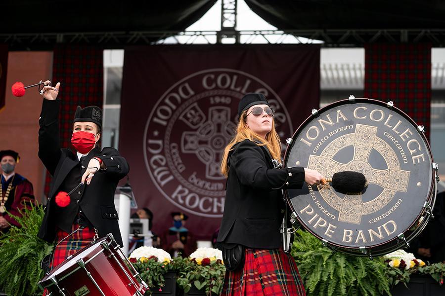 Two drummers from the pipe band play at the 2021 in-person recognition ceremony.