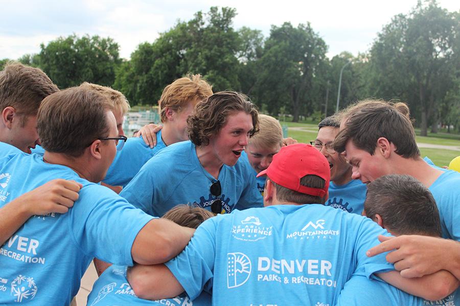 Aidan Connolly and his teammates in a huddle.