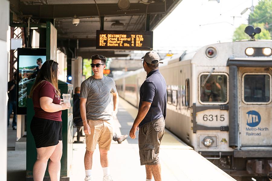 Students wait for the train at the Metro North station in New Rochelle.