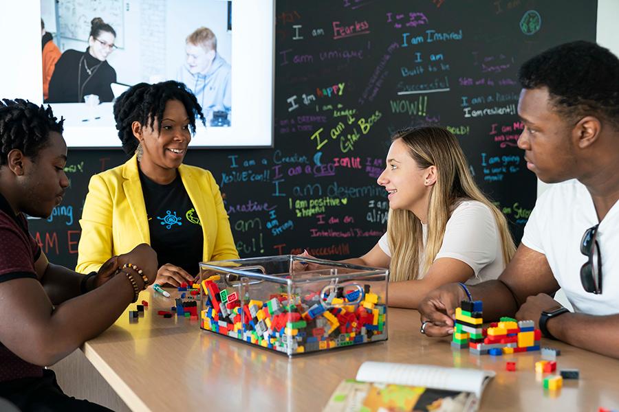 Rasheeda Weaver mentors students at the Hynes Institute.