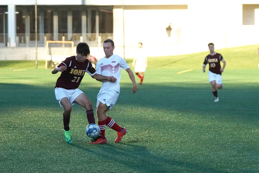 Iona men's club soccer defending the ball.