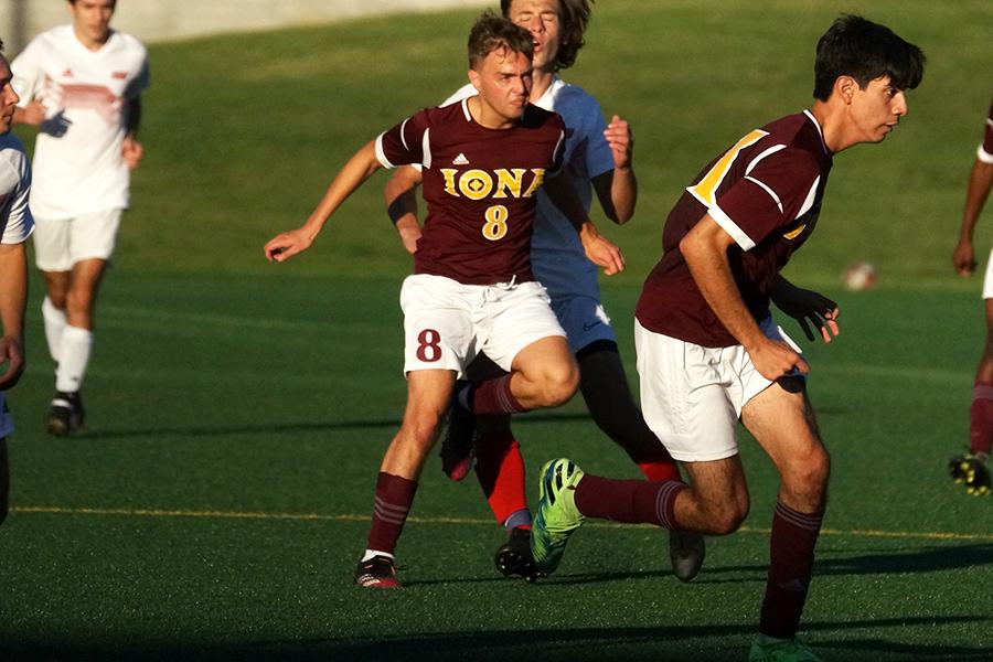 Iona men's club soccer playing offense.