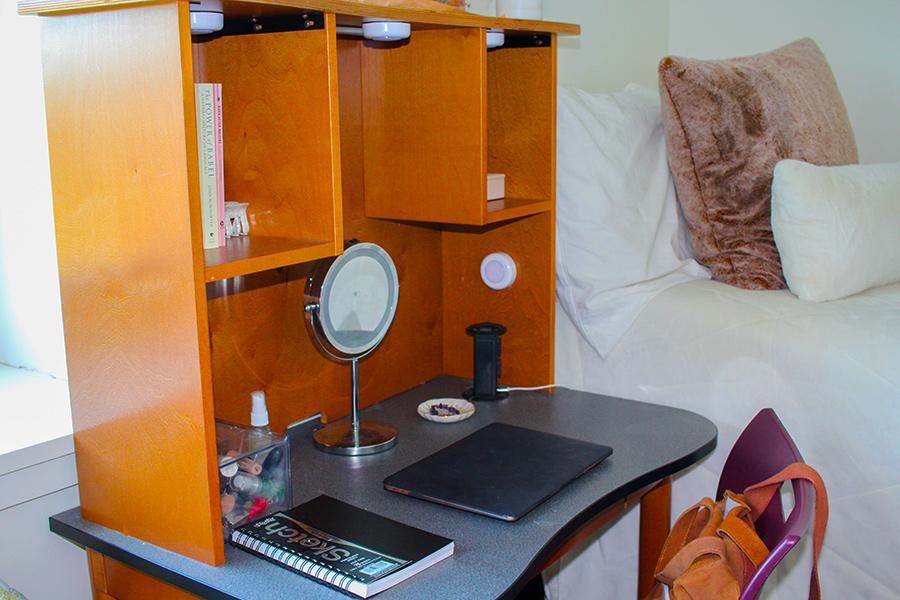 A desk with a mirror on it in North Ave. residence hall.