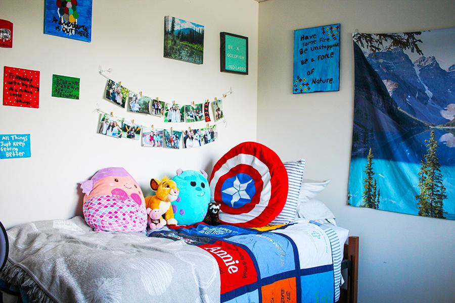 A bed decorated with cartoon characters in the North Ave. residence hall.