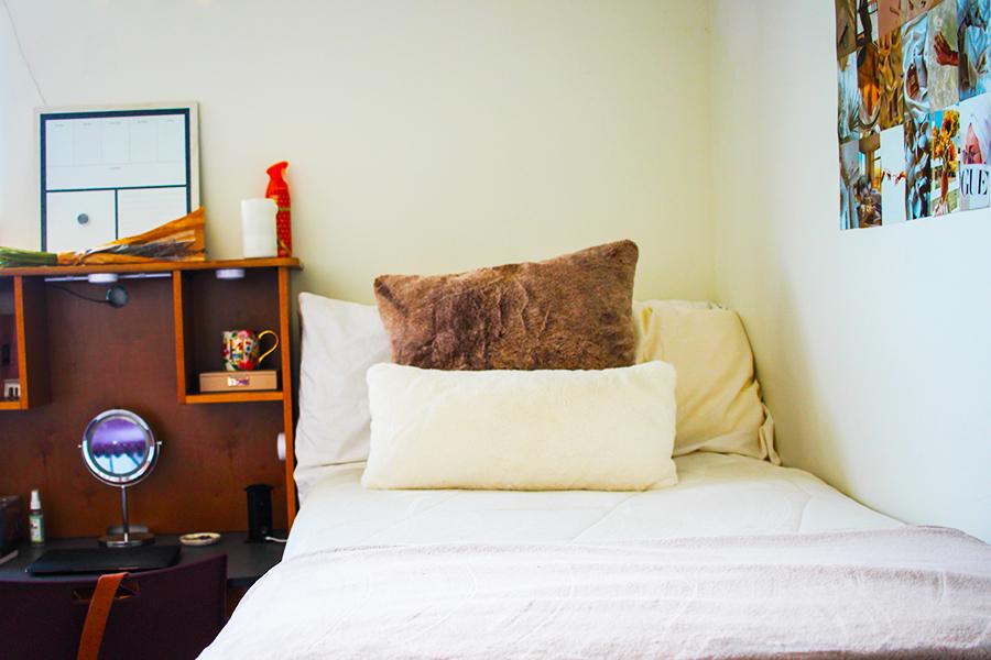 A white bed in the North Ave. residence hall.