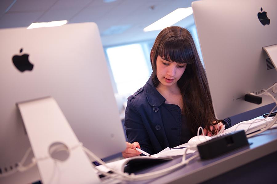 A student works on her minor in Computer Science.